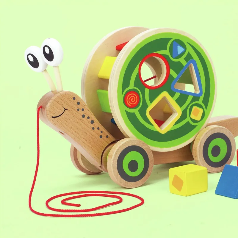 Loopslak met Vormenspel - Houten Trekfiguur met Blokken voor Peuters vanaf 12 Maanden by Hape in Multicolour – product photo