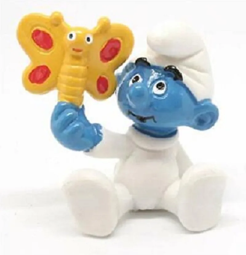 Baby smurf met vlinder - Schleich - Speelfiguurtje - 4cm by Schleich in Geel wit – product photo