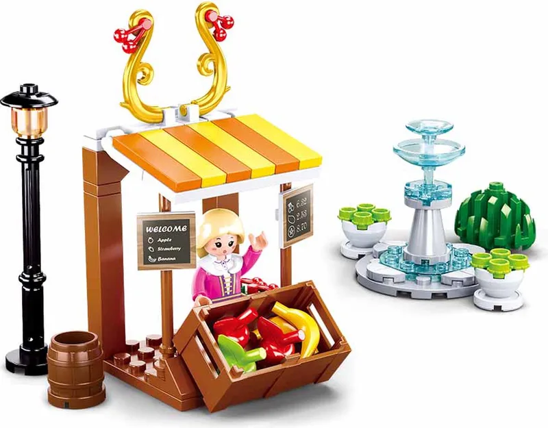bouwspeelgoed kinderen vanaf 6 jaar – Constructiespeelgoed modelbouw marktkraam – bouwdoos met 99 bouwstenen en 1 minifiguur – M38-B0870 van Sluban in Girls Dream Village Fruitkraam met Fontein – productfoto